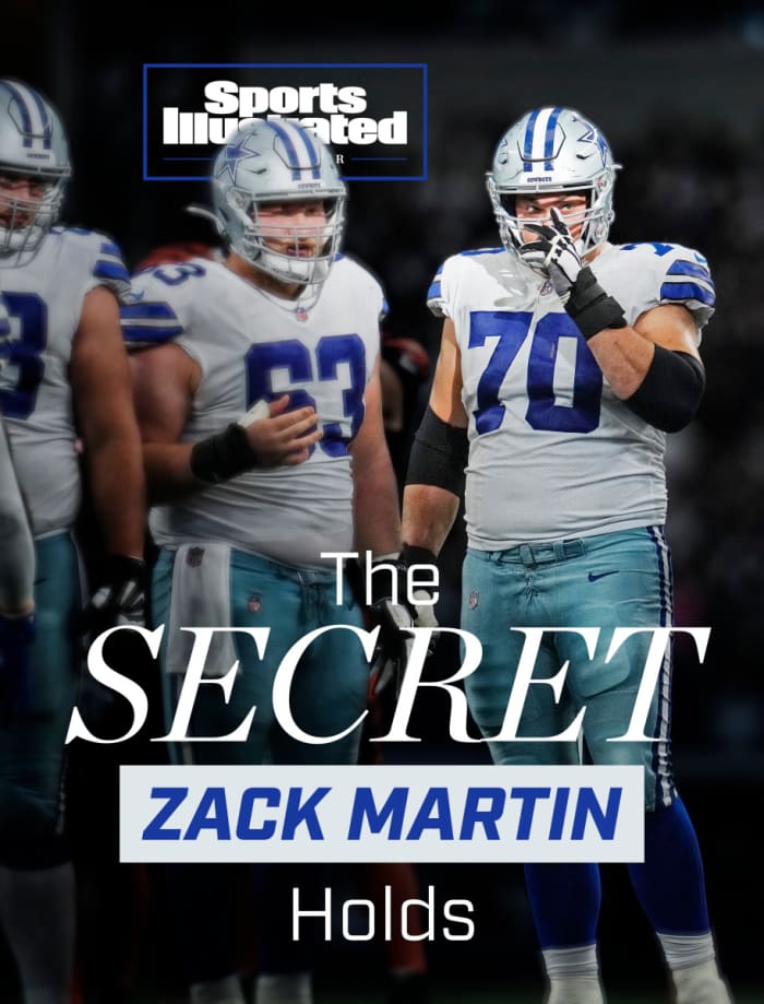 Zack Martin stands before a Cowboys huddle
